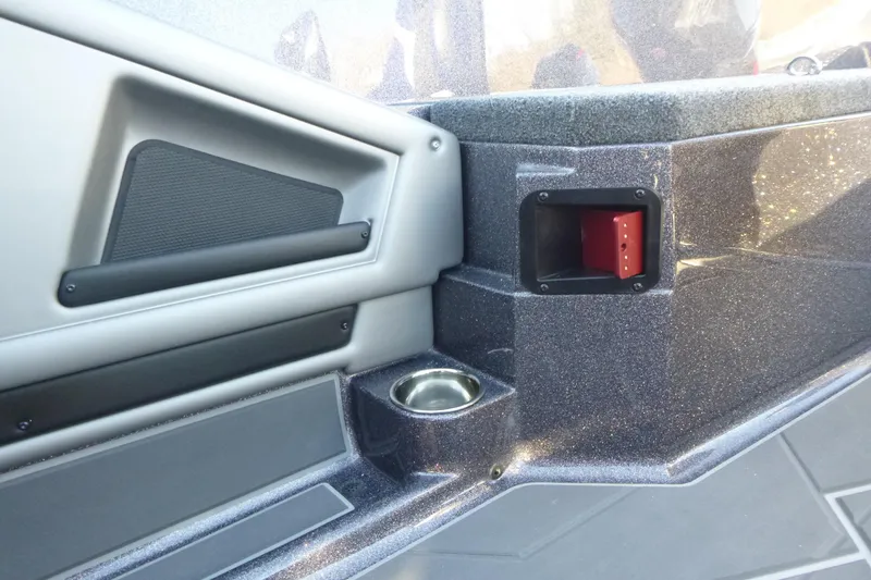 Slide: The Image of Interior detail of 2026 Ranger 621FS Pro boat, featuring cup holder and storage compartment. - 22