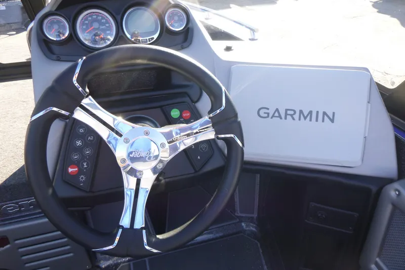 Slide: The Image of 2026 Ranger 621FS Pro boat dashboard with Garmin navigation system and steering wheel. - 25