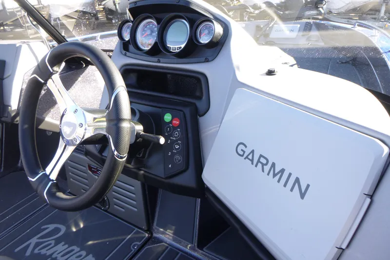 Slide: The Image of 2026 Ranger 621FS Pro boat dashboard with Garmin navigation system and steering wheel. - 26