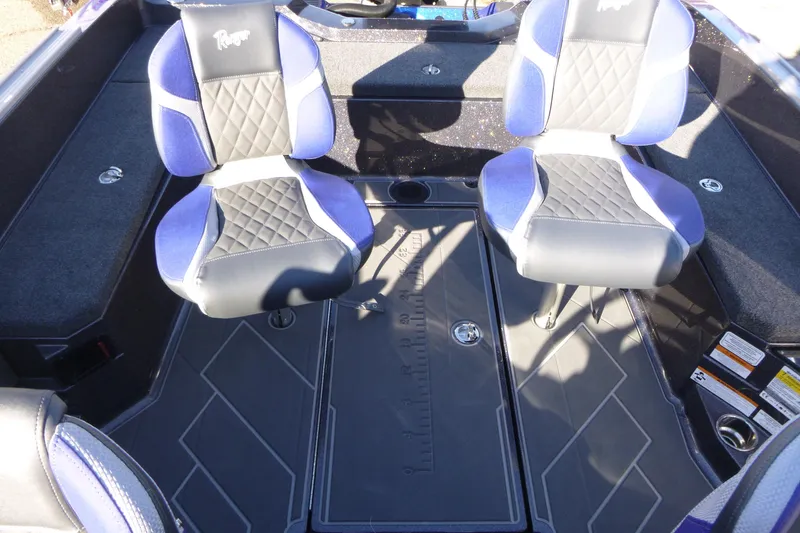 Slide: The Image of 2026 Ranger 621FS Pro boat interior with two cushioned seats and storage compartment. - 29