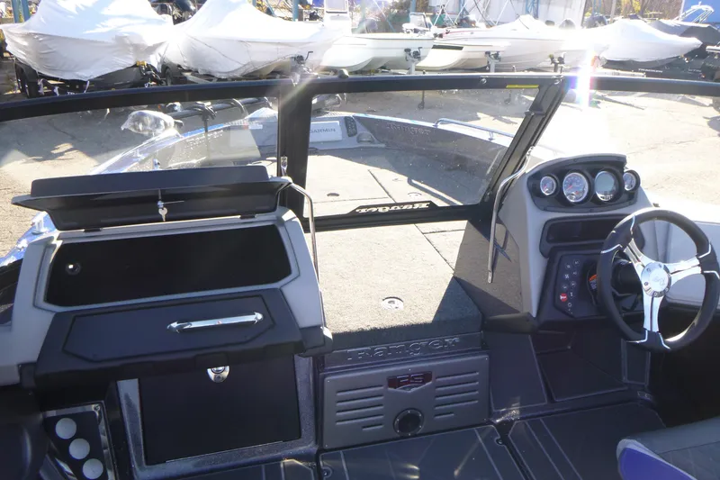 Slide: The Image of 2026 Ranger 621FS Pro boat interior with steering wheel and dashboard controls. - 31