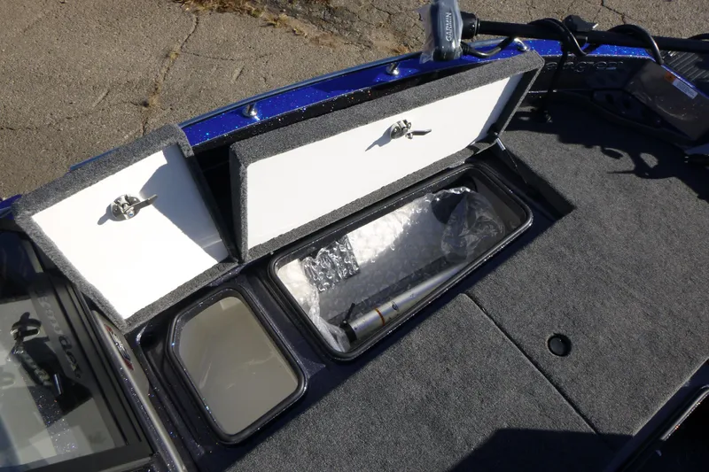 Slide: The Image of 2026 Ranger 621FS Pro boat storage compartments with open lids, showcasing interior space. - 34