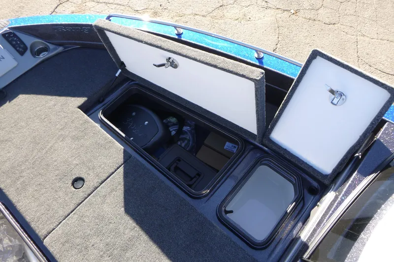 Slide: The Image of 2026 Ranger 621FS Pro boat storage compartments with open lids, showcasing interior features. - 36