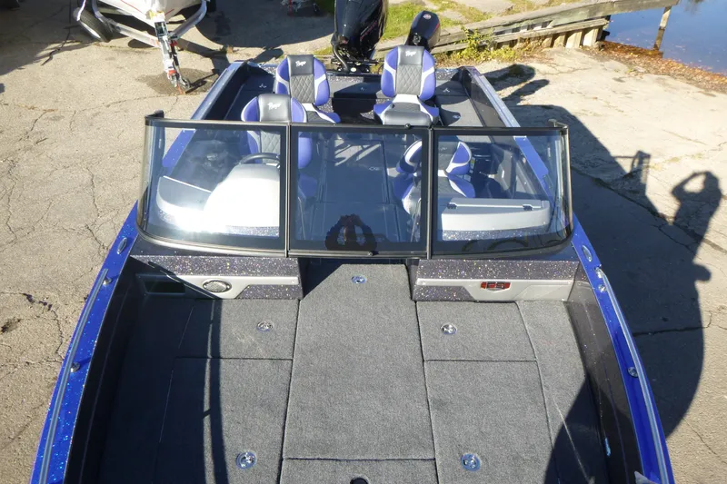 Slide: The Image of 2026 Ranger 621FS Pro boat with blue accents and spacious seating. - 44