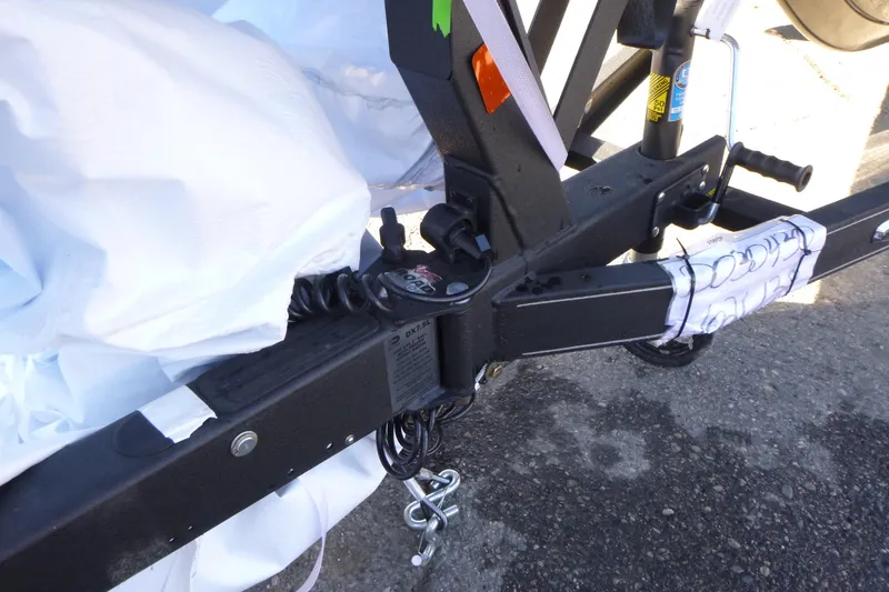 Slide: The Image of Trailer hitch of 2026 Ranger 621FS Pro boat on pavement. - 45