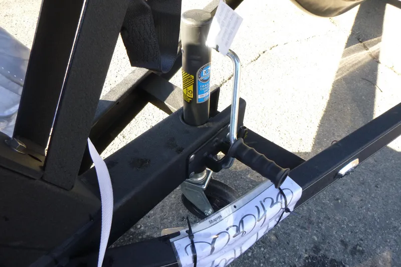 Slide: The Image of Trailer hitch of 2026 Ranger 621FS Pro boat on pavement. - 46