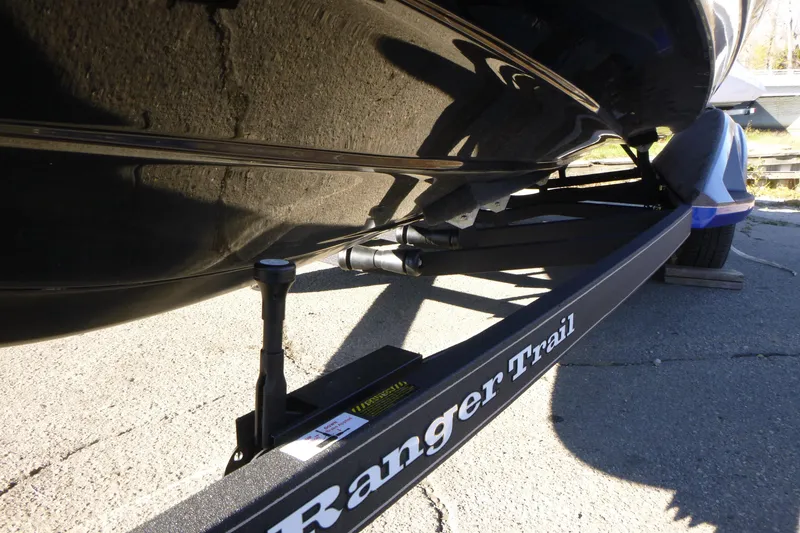 Slide: The Image of 2026 Ranger 621FS Pro boat on trailer, close-up view of hull and support. - 47