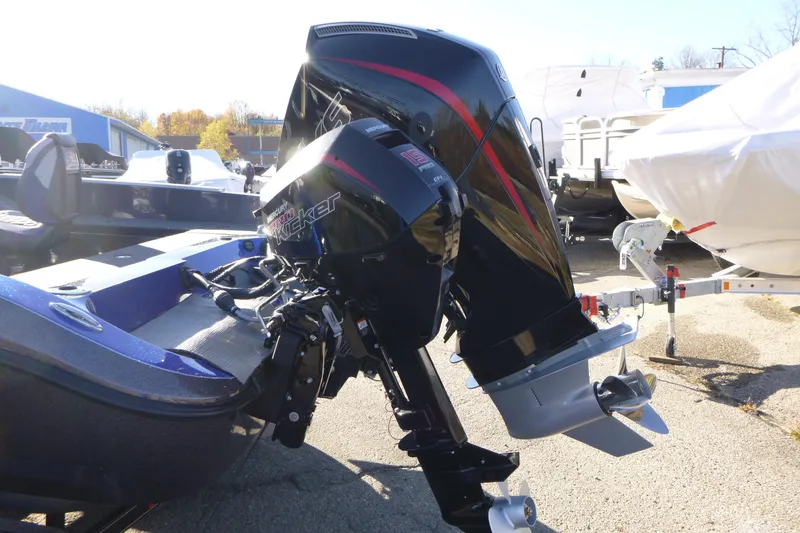 Slide: The Image of 2026 Ranger 621FS Pro boat with powerful Mercury outboard motor in a sunny marina. - 9