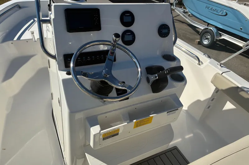 Slide: The Image of 2026 Key West 189 FS boat console with steering wheel and controls. - 12