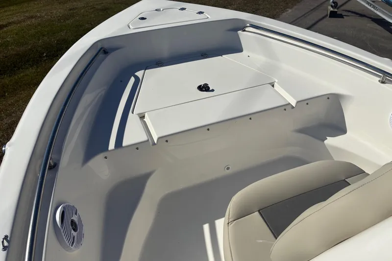 Slide: The Image of 2026 Key West 189 FS boat interior with seating and storage compartments. - 14