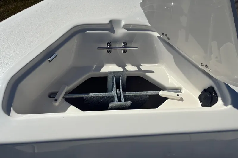 Slide: The Image of Anchor compartment of 2026 Key West 189 FS boat, open lid, white interior. - 16