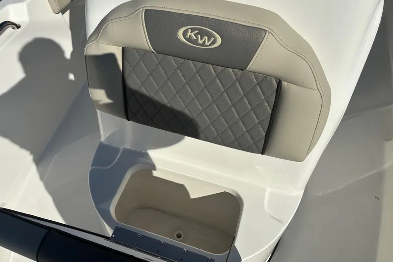 Slide: The Image of 2026 Key West 189 FS boat seat with quilted gray upholstery and storage compartment. - 18