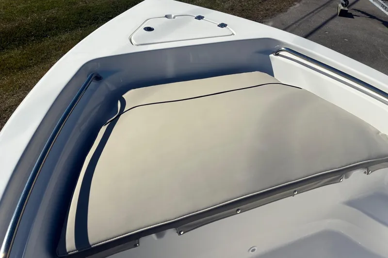 Slide: The Image of 2026 Key West 189 FS boat with cushioned seating and stainless steel railing. - 20