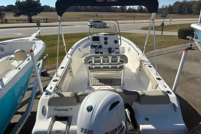 Slide: The Image of 2026 Key West 189 FS boat with Yamaha engine, parked outdoors on a sunny day. - 5