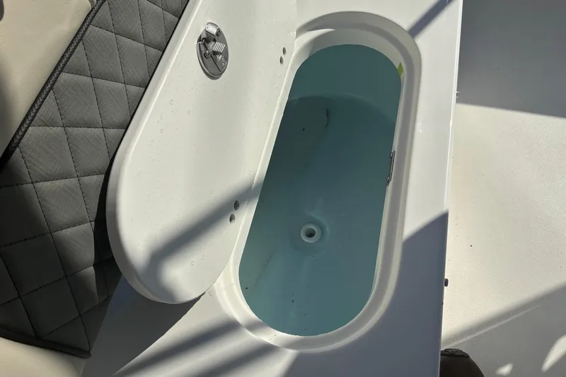 Slide: The Image of Open storage compartment on 2026 Key West 189 FS boat, showing interior details. - 9