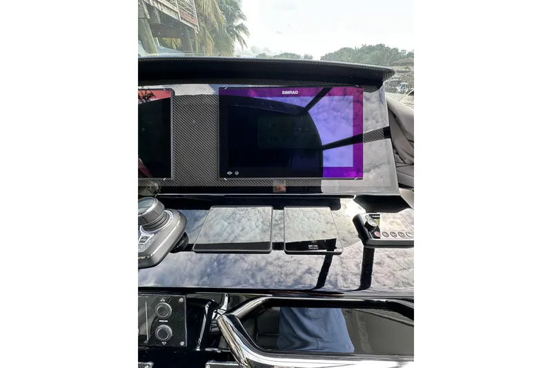 Slide: The Image of 2024 Pardo Yachts P38 dashboard with Simrad display and control panel. - 14