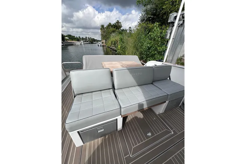 Slide: The Image of 2024 Pardo Yachts P38 deck with sleek seating and scenic waterway view. - 41