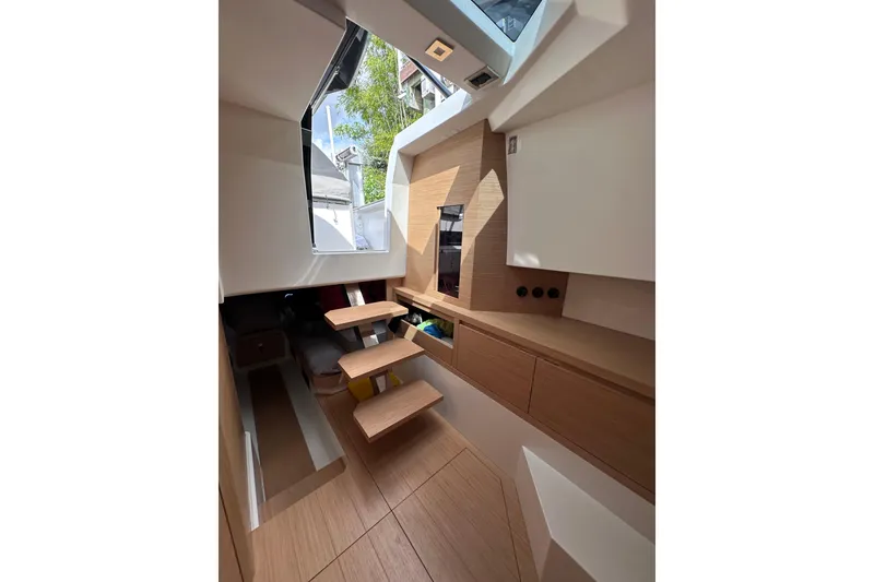 Slide: The Image of Interior of 2024 Pardo Yachts P38, featuring modern wood design and natural light. - 62