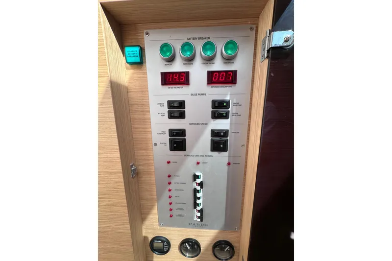 Slide: The Image of Control panel of 2024 Pardo Yachts P38, featuring battery breakers and voltage display. - 64