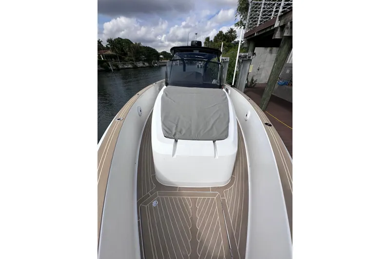 Slide: The Image of 2024 Pardo Yachts P38 luxury boat docked, featuring sleek design and spacious deck. - 9