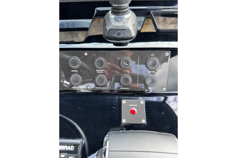 Slide: The Image of 2024 Pardo Yachts P38 control panel with joystick and button interface. - 19