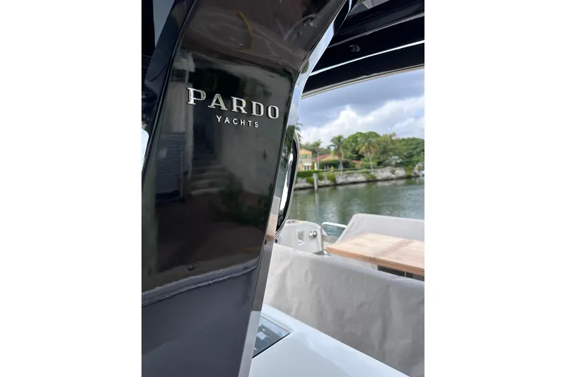 Slide: The Image of 2024 Pardo Yachts P38, sleek design, docked by scenic waterfront. - 28