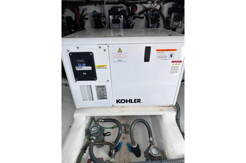 Slide: The Image of Kohler generator in 2024 Pardo Yachts P38 engine room, showcasing marine equipment. - 46