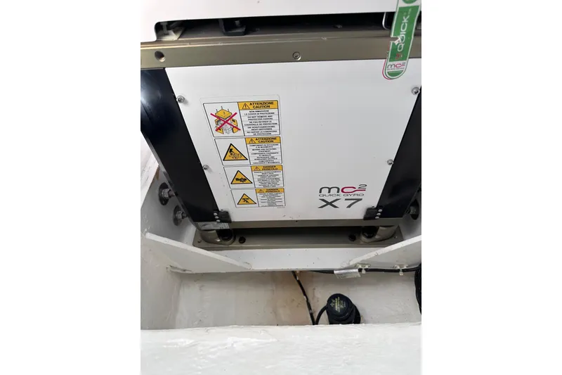 Slide: The Image of 2024 Pardo Yachts P38 MC2 Quick Gyro X7 stabilizer system with caution labels. - 47