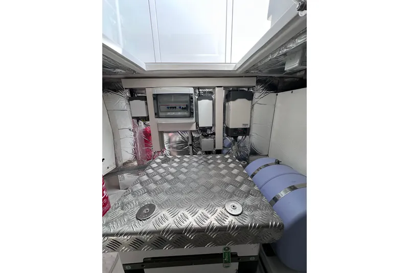 Slide: The Image of Engine room of 2024 Pardo Yachts P38, featuring metallic flooring and equipment. - 48