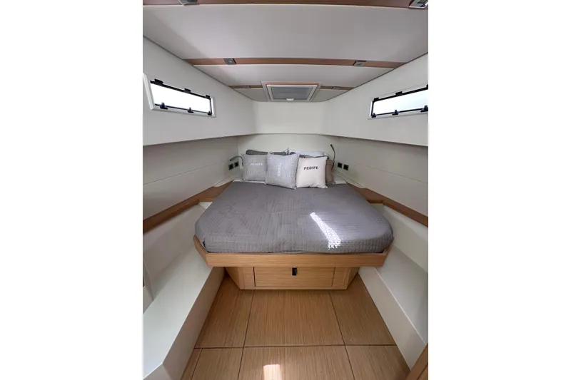 Slide: The Image of 2024 Pardo Yachts P38 cabin interior with modern design and cozy bedding. - 60