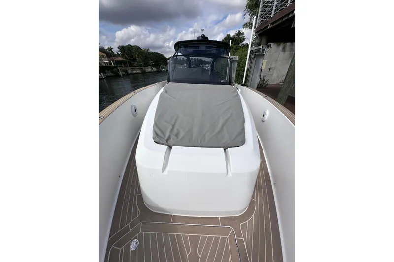 Slide: The Image of 2024 Pardo Yachts P38 boat with sleek deck design and cushioned seating. - 8