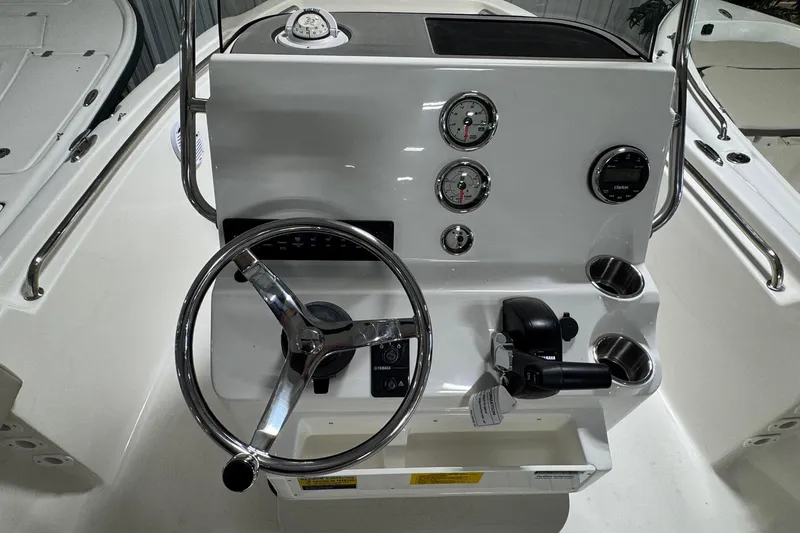 Slide: The Image of 2026 Key West 189 FS boat console with steering wheel and gauges. - 13