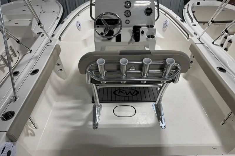 Slide: The Image of 2026 Key West 189 FS boat interior with steering console and rod holders. - 5