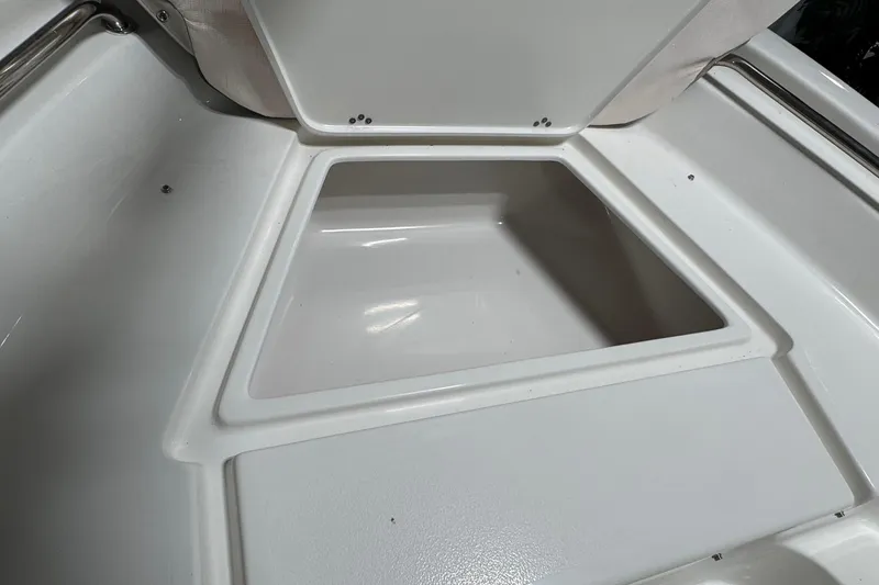 Slide: The Image of Storage compartment in 2026 Key West 189 FS boat, open and empty. - 8