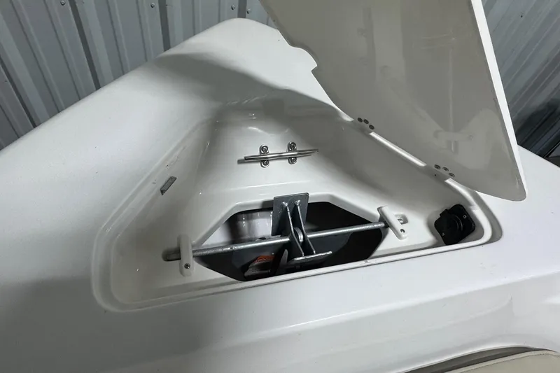 Slide: The Image of Open anchor compartment on 2026 Key West 189 FS boat, showing anchor storage. - 9