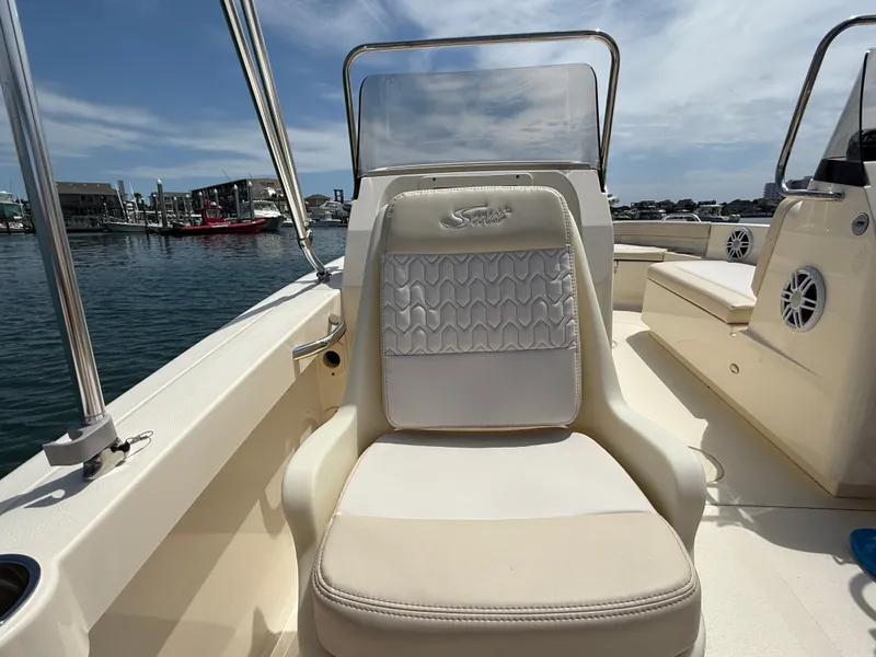 Slide: The Image of Scout 188 Sport Dorado 2026 boat seat on calm water. - 12