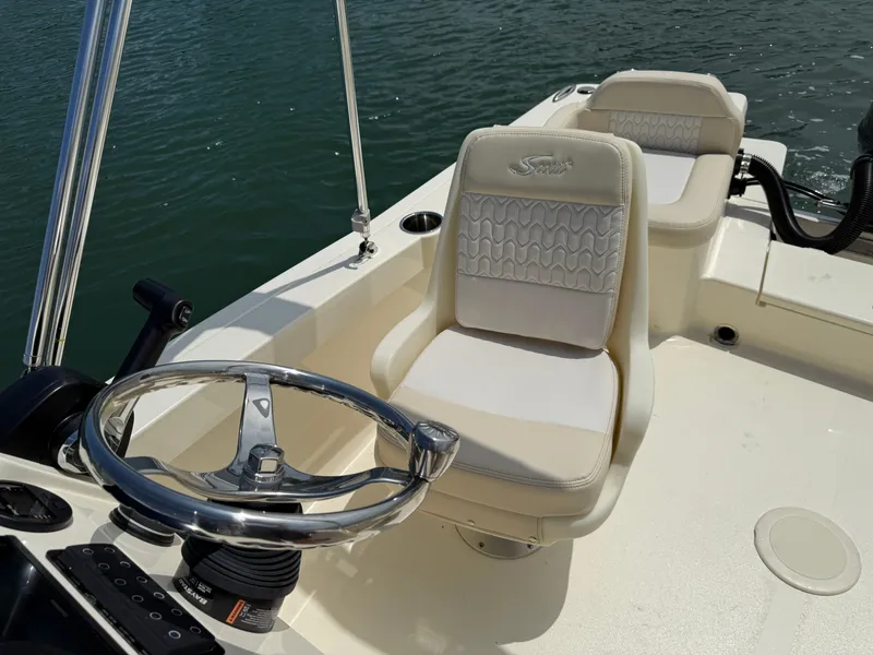 Slide: The Image of Scout 188 Sport Dorado 2026, interior view with steering wheel and seats. - 16