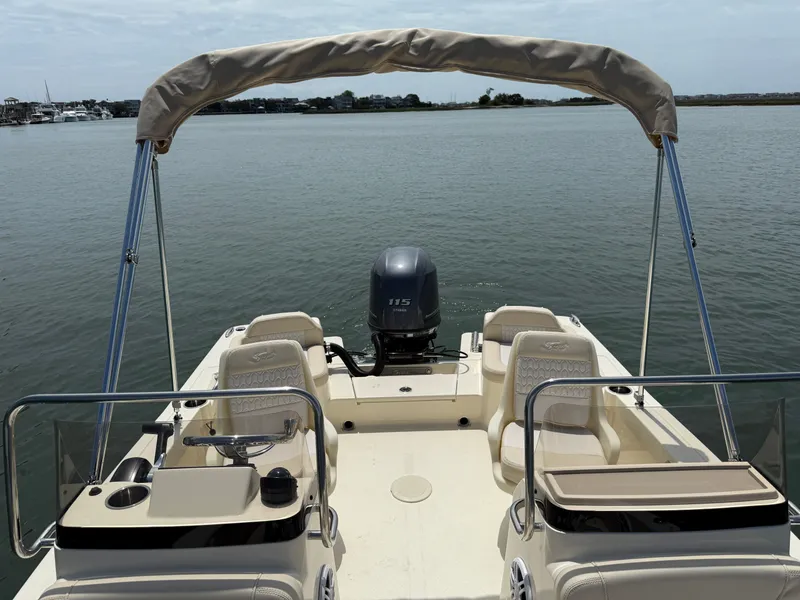 Slide: The Image of Scout 188 Sport Dorado 2026 on calm water with Bimini top. - 18