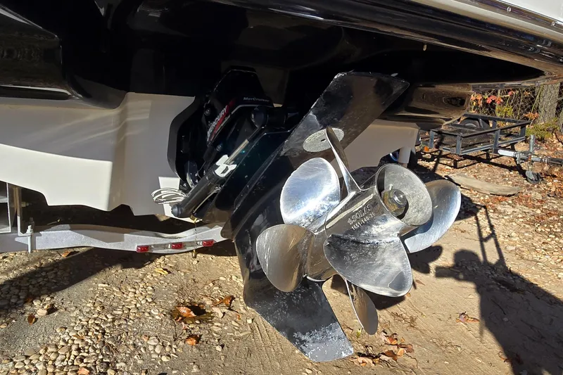 Slide: The Image of Propeller of 2002 Sea Ray 220 Bow Rider boat on a trailer. - 11