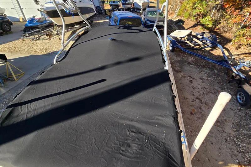 Slide: The Image of Covered 2002 Sea Ray 220 Bow Rider boat in storage yard. - 14