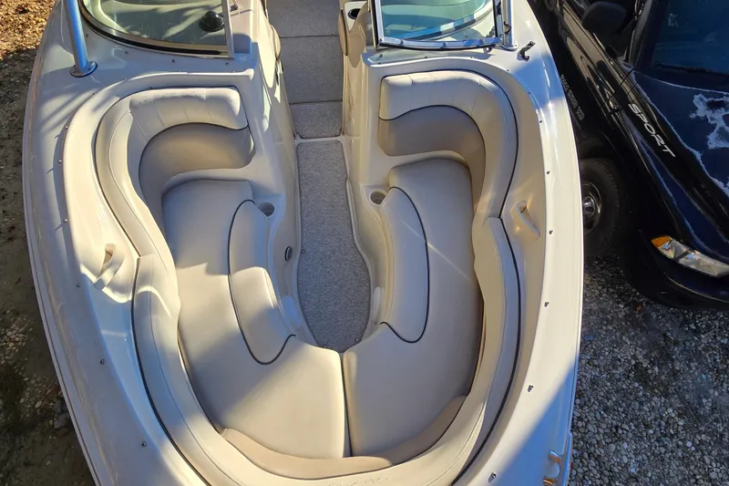 Slide: The Image of 2002 Sea Ray 220 Bow Rider boat interior with spacious seating and elegant design. - 18