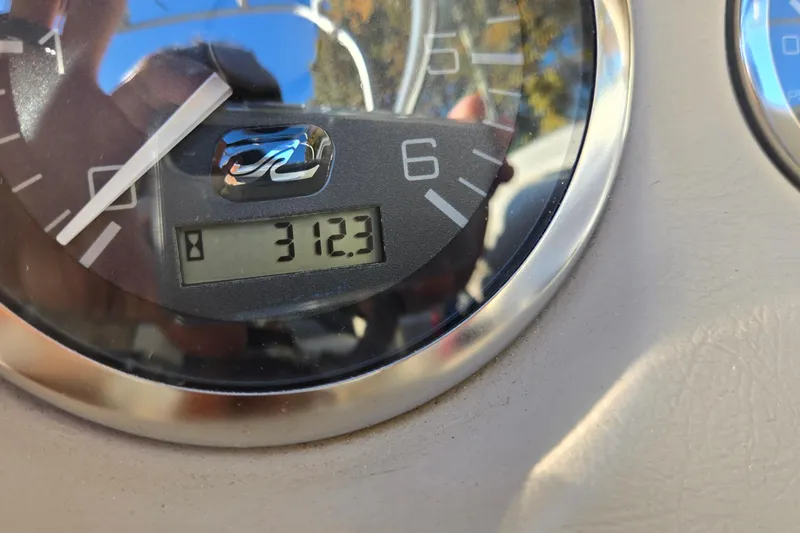 Slide: The Image of Close-up of a Sea Ray 220 Bow Rider 2002 boat gauge showing 312.3 hours. - 19