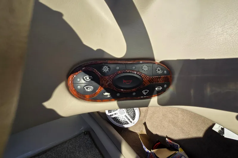 Slide: The Image of Control panel of a 2002 Sea Ray 220 Bow Rider boat interior. - 23