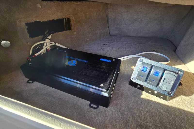 Slide: The Image of Electrical components inside a 2002 Sea Ray 220 Bow Rider boat compartment. - 25