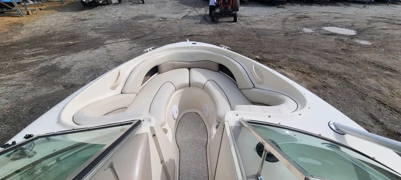 Slide: The Image of 2002 Sea Ray 220 Bow Rider boat interior with spacious seating and open deck. - 30