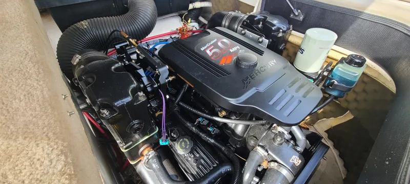 Slide: The Image of Engine of a 2002 Sea Ray 220 Bow Rider boat, showcasing detailed components. - 44