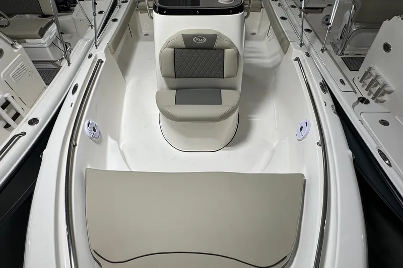Slide: The Image of 2026 Key West 189 FS boat interior with cushioned seating and sleek design. - 10