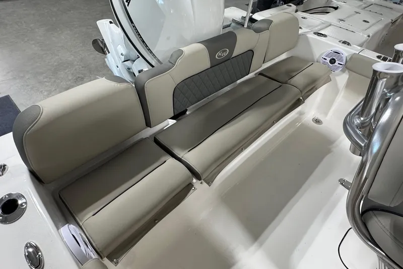 Slide: The Image of 2026 Key West 189 FS boat interior with cushioned seating and storage compartments. - 14