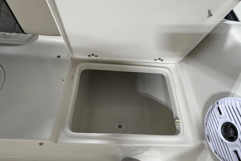 Slide: The Image of Open storage compartment in 2026 Key West 189 FS boat interior. - 17