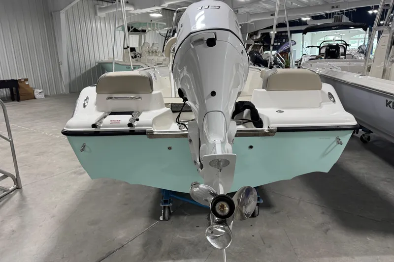 Slide: The Image of 2026 Key West 189 FS boat in showroom, rear view with outboard motor. - 4